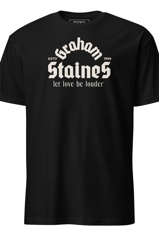 “Graham Staines – Let Love Be Louder” Christian Black graphic tee, inspired by 1 Corinthians 13:13. Faith-based gift, scripture-inspired apparel for men and women.