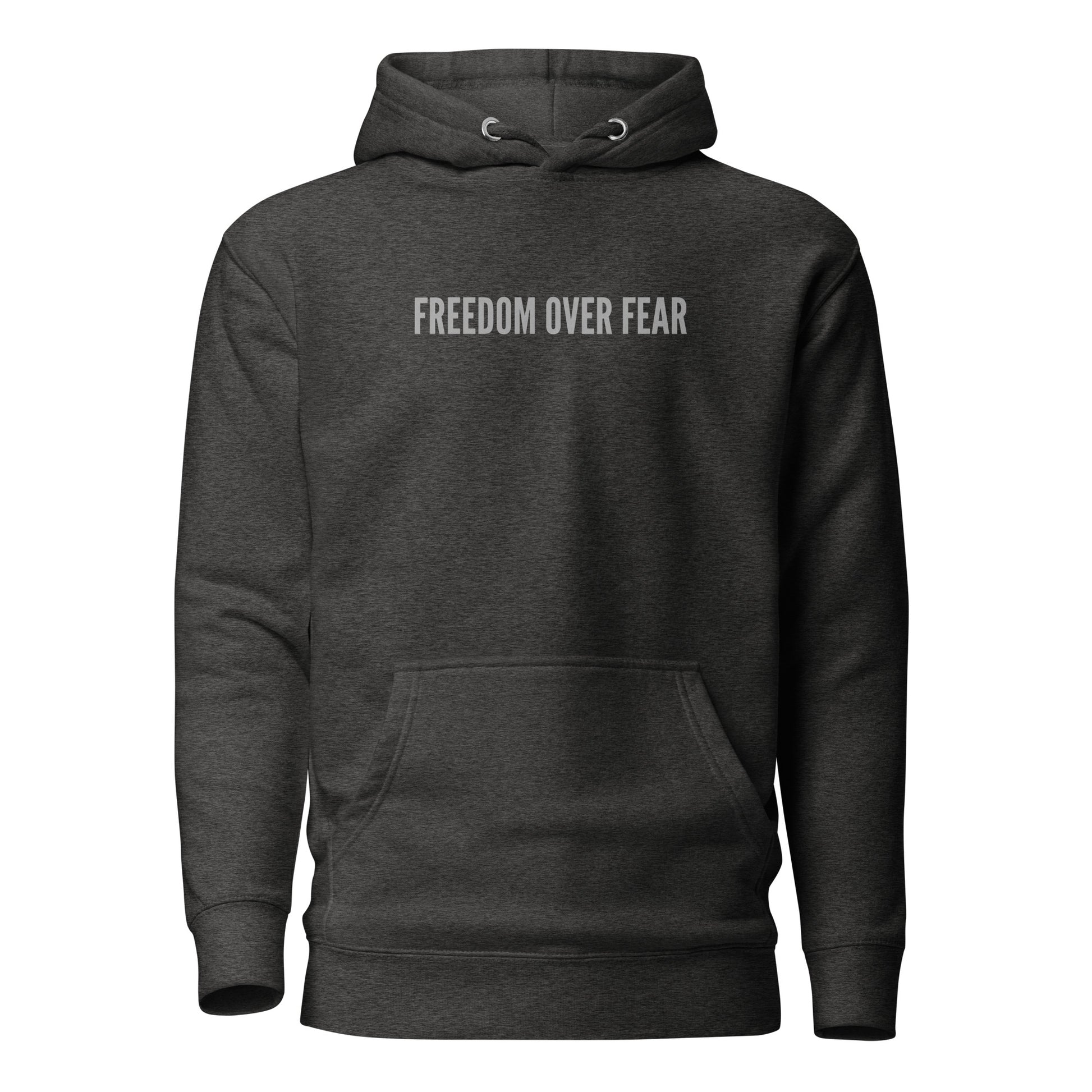 Product mockupUnisex premium Christian hoodie with “Freedom Over Fear” design – faith-based fashion and gift by Zyora Apparel.