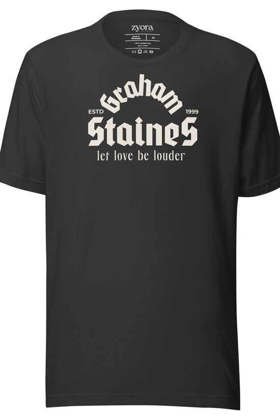 “Graham Staines – Let Love Be Louder” Christian Dark Grey graphic tee, inspired by 1 Corinthians 13:13. Faith-based gift, scripture-inspired apparel for men and women.
