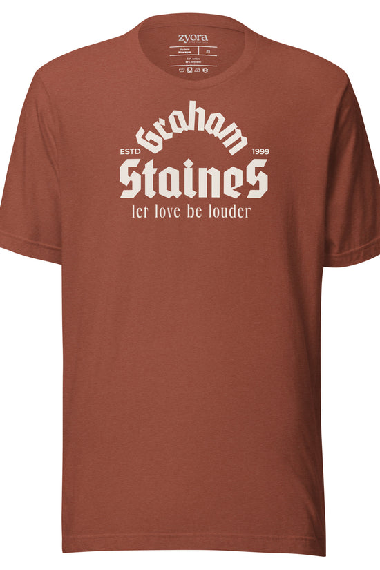 “Graham Staines – Let Love Be Louder” Christian Heather Clay graphic tee, inspired by 1 Corinthians 13:13. Faith-based gift, scripture-inspired apparel for men and women.